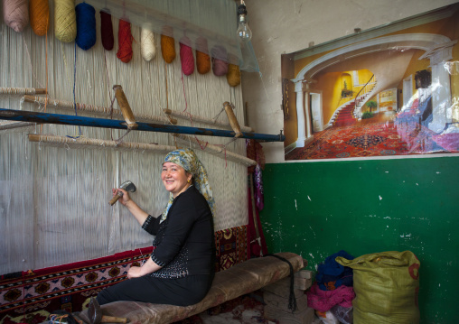 Uyghur Woman Making A Carpet, Keriya, Old Town, Xinjiang Uyghur Autonomous Region, China