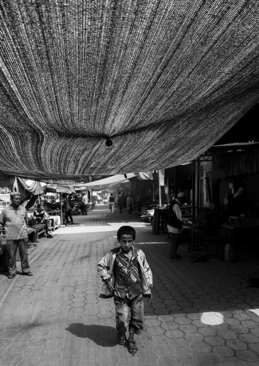 Young Boy Walking Hin The Covered Market, Keriya, Xinjiang Uyghur Autonomous Region, China