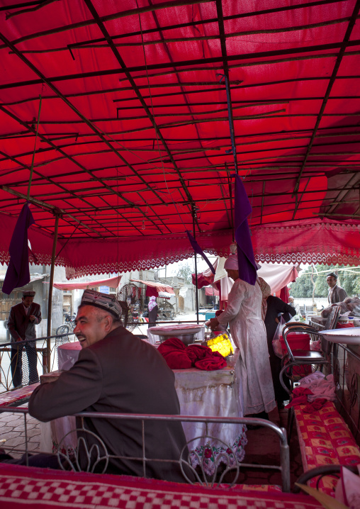 Man Sitted In Open-air Restaurant, Keriya, Xinjiang Uyghur Autonomous Region, China