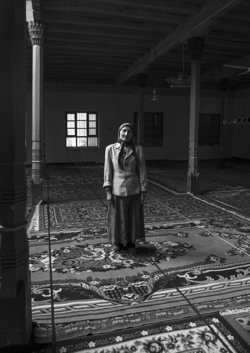 Uyghur Woman Standing Inside Of A Mosque, Minfeng, Xinjiang Uyghur Autonomous Region, China