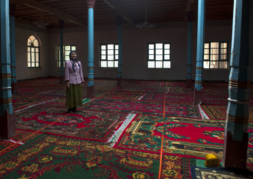 Uyghur Woman Standing Inside Of A Mosque, Minfeng, Xinjiang Uyghur Autonomous Region, China