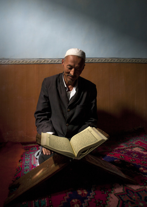 Uyghur Man Studying The Quran, Minfeng, Xinjiang Uyghur Autonomous Region, China