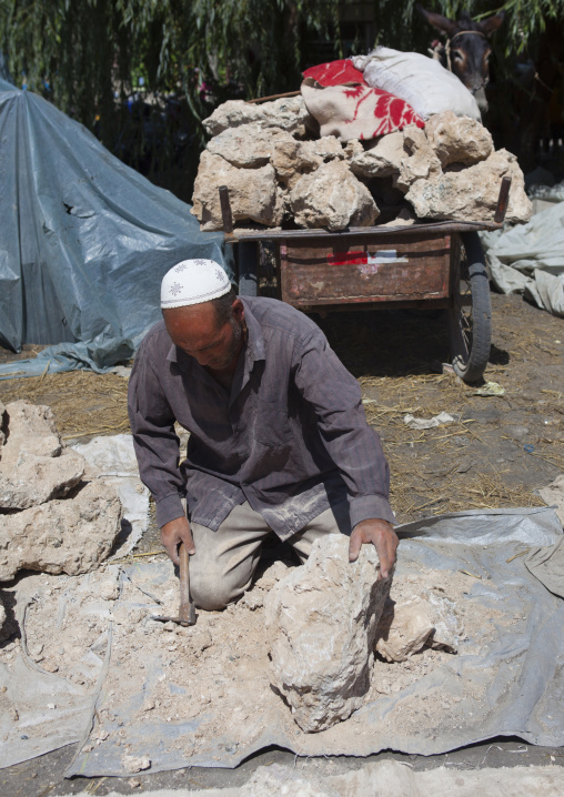 Uyghur Man Preparing Blocks Of Salt,  Yecheng, Xinjiang Uyghur Autonomous Region, China