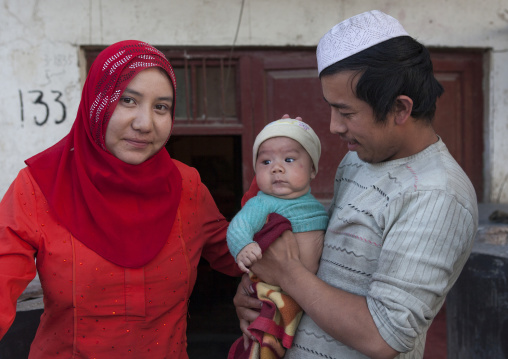 Uyghur Couple And Newborn Baby, Yarkand, Xinjiang Uyghur Autonomous Region, China