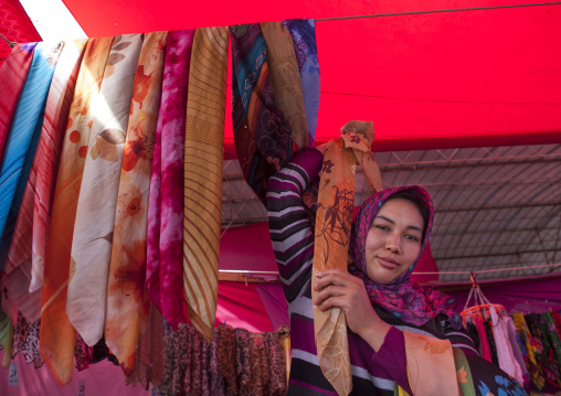 Young Uyghur Woman Selling Scarfs, Serik Buya Market, Yarkand, Xinjiang Uyghur Autonomous Region, China