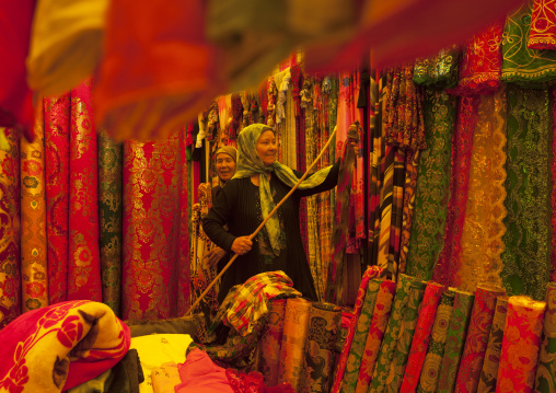 Uyghur Women Chsing Cloth In Serik Buya Market, Yarkand, Xinjiang Uyghur Autonomous Region, China
