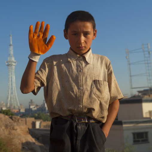 Uyghur Boy waving his hand, Xinjiang Uyghur Autonomous Region, China