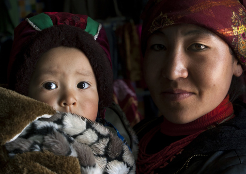 Kyrgyz Mother And Her Child Near Karakul Lake, Xinjiang Uyghur Autonomous Region, China