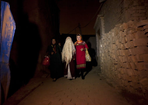 Bride in the street during A Wedding In Uyghur Family, Kashar, Xinjiang Uyghur Autonomous Region, China