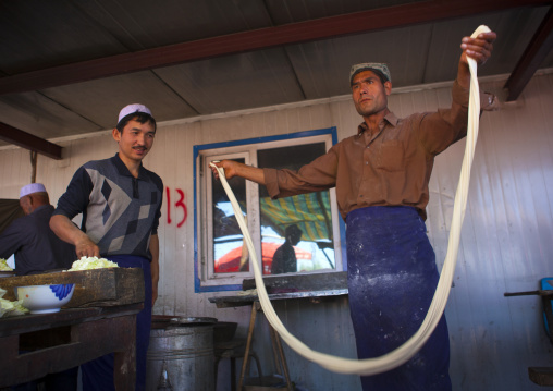 Uyghur Man Making Fresh Laghman Noodles In Kashgar Animal Market, Xinjiang Uyghur Autonomous Region, China
