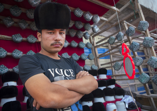 Young Man Selling Doppi Muslim Hats, Opal Village Market, Xinjiang Uyghur Autonomous Region, China