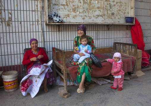 Uyghur Family in the street, Kashgar, Xinjiang Uyghur Autonomous Region, China