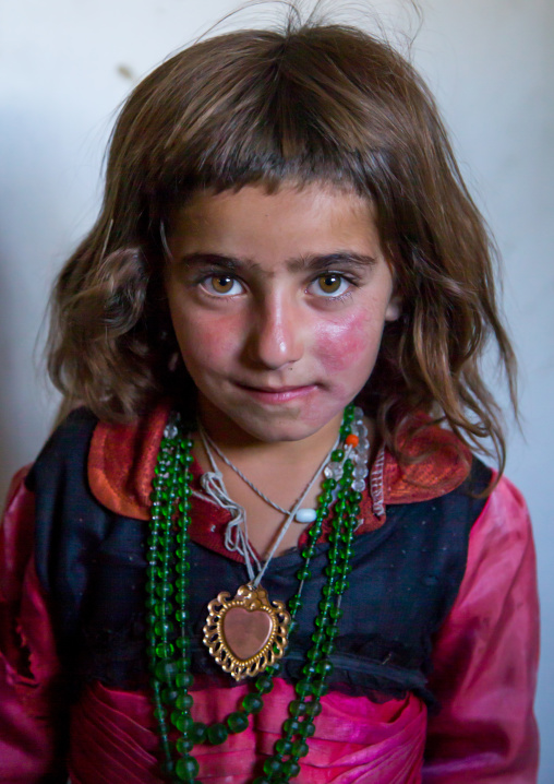 Portrait of an afghan girl with red cheecks, Badakhshan province, Khandood, Afghanistan