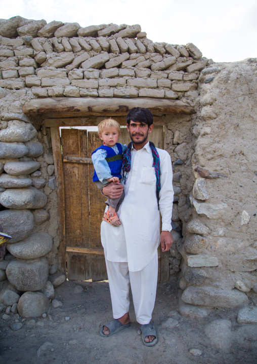 Portrait of an afghan boy with blonde hair with his father, Badakhshan province, Khandood, Afghanistan