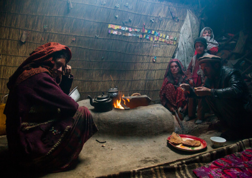 Wakhi nomad family eating breakfast inside their yurt, Big pamir, Wakhan, Afghanistan