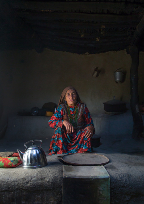 Portrait of an afghan woman in pamiri traditional clothing, Badakhshan province, Wuzed, Afghanistan