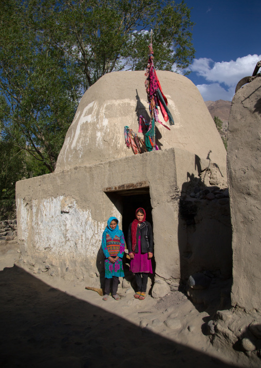 Afghan girls in front of an old muslim shrine, Badakhshan province, Khandood, Afghanistan