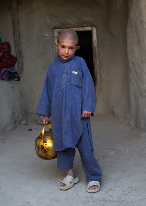 Afghan boy with shaved head, Badakhshan province, Khandood, Afghanistan