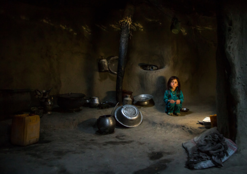 Afghan girl inside a traditional pamiri kitchen, Badakhshan province, Khandood, Afghanistan