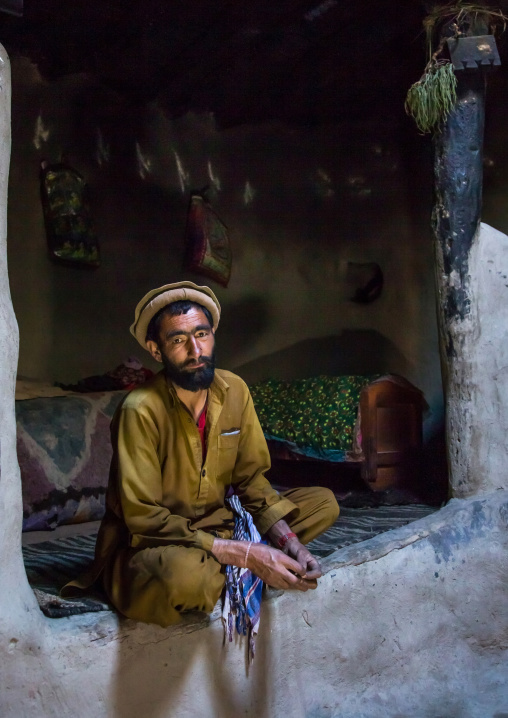 Afghan man inside his traditional pamiri house, Badakhshan province, Khandood, Afghanistan