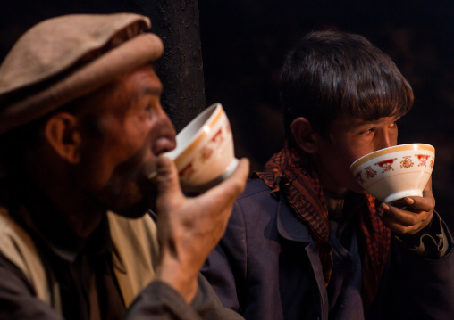 Wakhi men drinking salty milk tea, Big pamir, Wakhan, Afghanistan