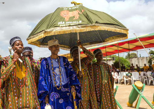Benin, West Africa, Porto-Novo, king gbèmédô tognon zounon walking under an umbrella