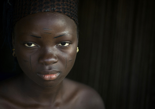 Benin, West Africa, Onigbolo Isaba, holi tribe woman covered with traditional facial tattoos and scars portrait
