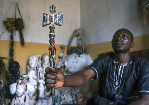 Benin, West Africa, Bonhicon, kagbanon bebe voodoo priest during a ceremony holding a shango stick