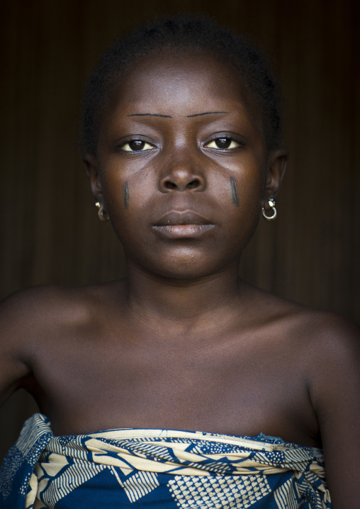 Benin, West Africa, Onigbolo Isaba, holi tribe girl with traditional facial tattoos and scars