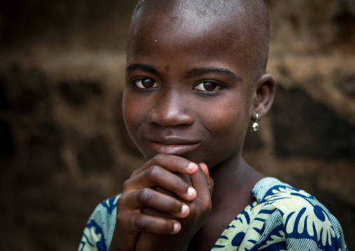 Benin, West Africa, Savalou, shy and shaved beautiful beninese girl