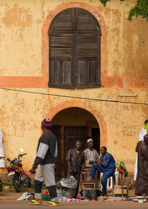 Benin, West Africa, Copargo, men in front of an old colonial house
