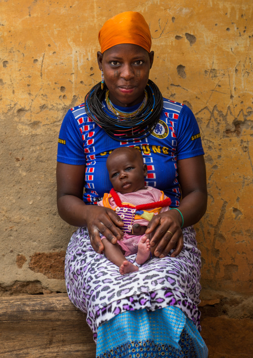 Benin, West Africa, Copargo, a beautiful tattooed fulani peul tribe woman with her baby