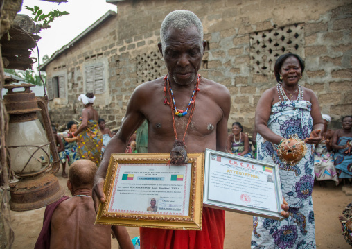 Benin, West Africa, Bopa, dah tofa voodoo master showing his diplomas