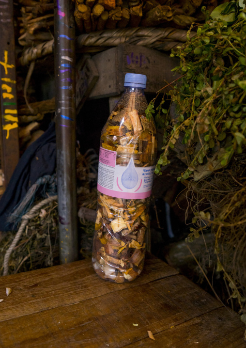Benin, West Africa, Cotonou, piece of woods in a bottle used for traditional medicine in dantokpa market