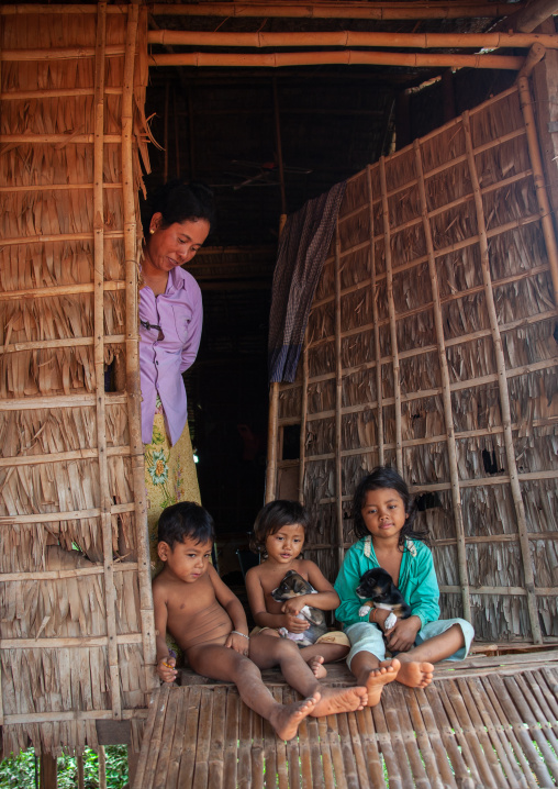 Cambodian woman with her children in the floating village on Tonle Sap lake, Siem Reap Province, Chong Kneas, Cambodia