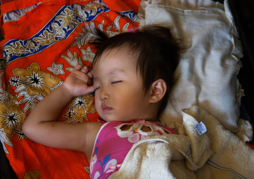 Cambodian baby sleeping on his back, Phnom Penh province, Phnom Penh, Cambodia
