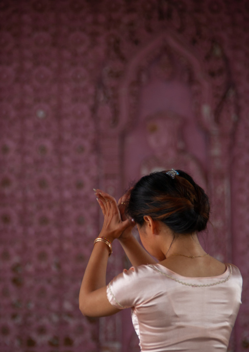 Cambodian dancer praying before a training session of the National ballet, Phnom Penh province, Phnom Penh, Cambodia