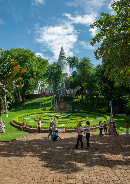 White stupa and large ornamental garden clock in the grounds of wat Phnom, Phnom Penh province, Phnom Penh, Cambodia