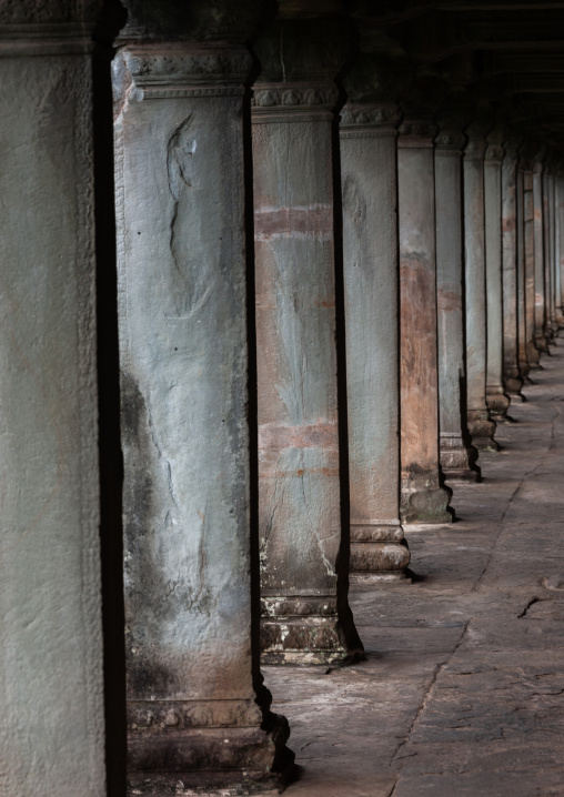 Empty corridor with columns inside a temple in Angkor wat, Siem Reap Province, Angkor, Cambodia