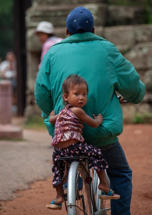 Father taking his son by bike, Siem Reap Province, Angkor, Cambodia