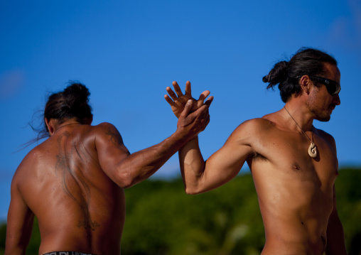 Tattooed Men Ready For Canoe Competition At Anakena beach, Easter Island, Chile