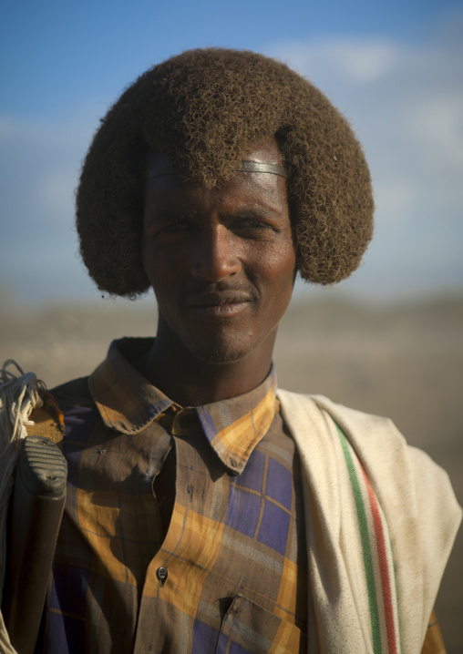 Portrait Of A Karrayyu Man With A Traditional Gunfura Hairstyle In Gadaaa Ceremony, Metehara, Ethiopia