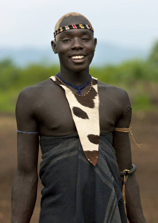 Cute Fashionable Bodi Boy With Traditional Loincloth Smile Looking At Camera Omo Valley Ethiopia