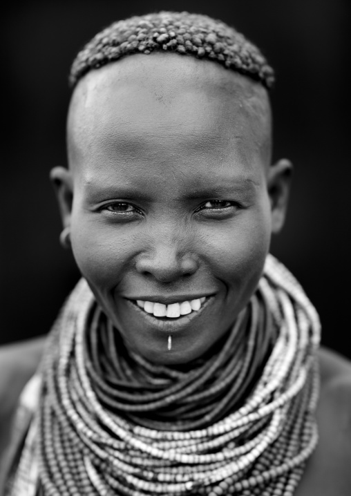 Portrait Of Beautiful Dark Eyed Karo Woman Wearing Beaded Necklace Ethiopia