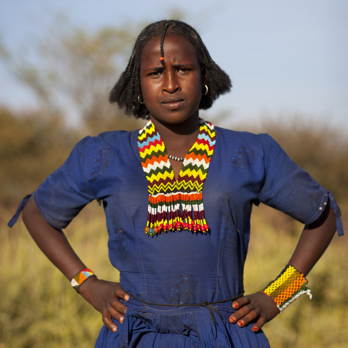 Portrait Of A Proud Oromo Tribe Woman With Stranded Hair And Colourful Necklace, Metehara, Ethiopia