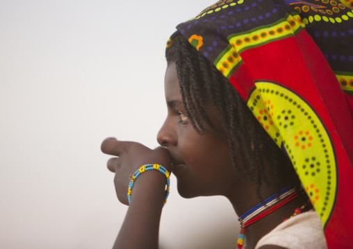 Profile Portrait Of A Karrayyu Tribe Teenage Girl With A Colourful Headscarf During Gadaaa Ceremony, Metahara, Ethiopia