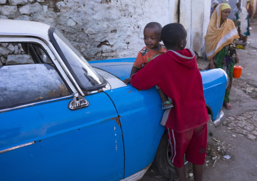 Children In Front Of An Old Peugeot 404, Harar, Ethiopia