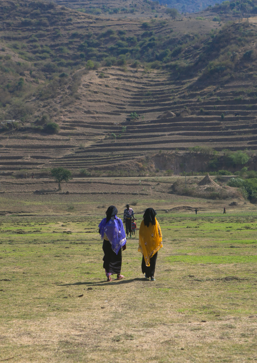 Oromo women in burqa walking in the plain, Amhara region, Artuma, Ethiopia