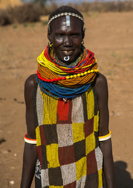 Murle tribe woman with a beaded apron and necklaces, Omo valley, Kangate, Ethiopia