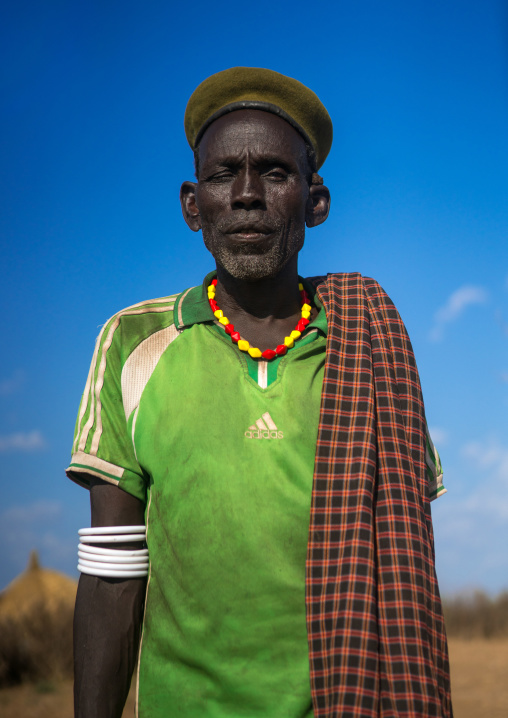Murle tribe old man with a beret, Omo valley, Kangate, Ethiopia